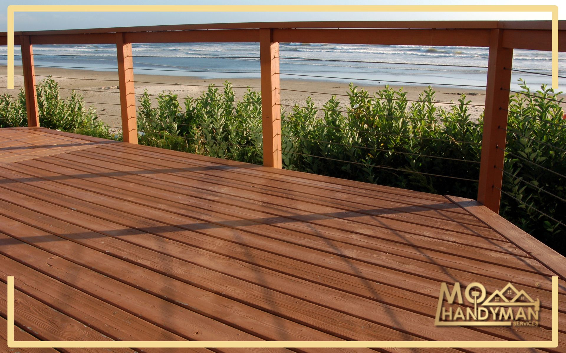 Close-up of applying the best deck stains with a brush, featuring various deck staining techniques for a uniform and long-lasting finish.