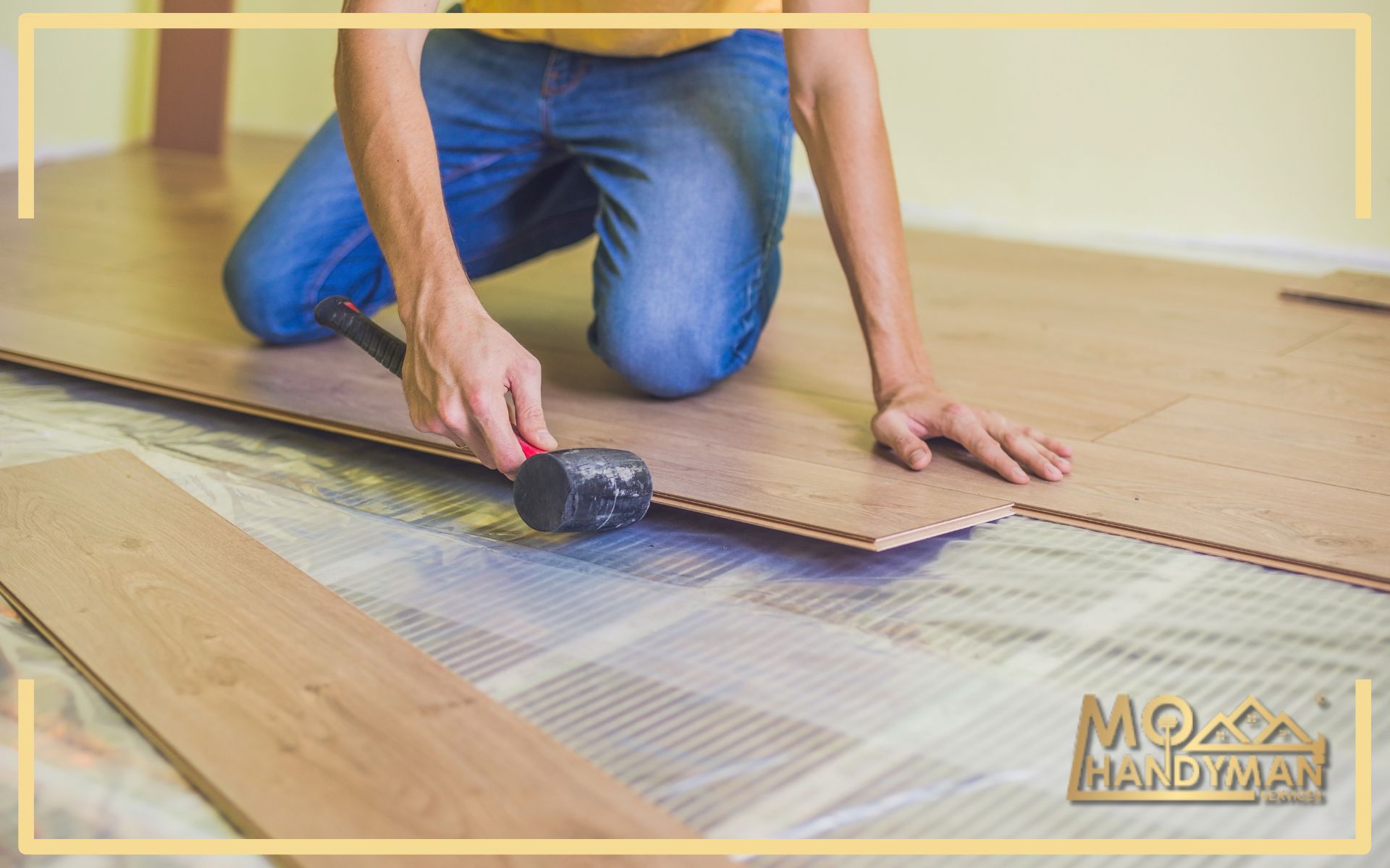 A detailed view of a handyman's hands securing a wooden floor panel with a mallet, a key step in the precision flooring installation process by a MoHandyman expert, showcasing their attention to detail and quality service.