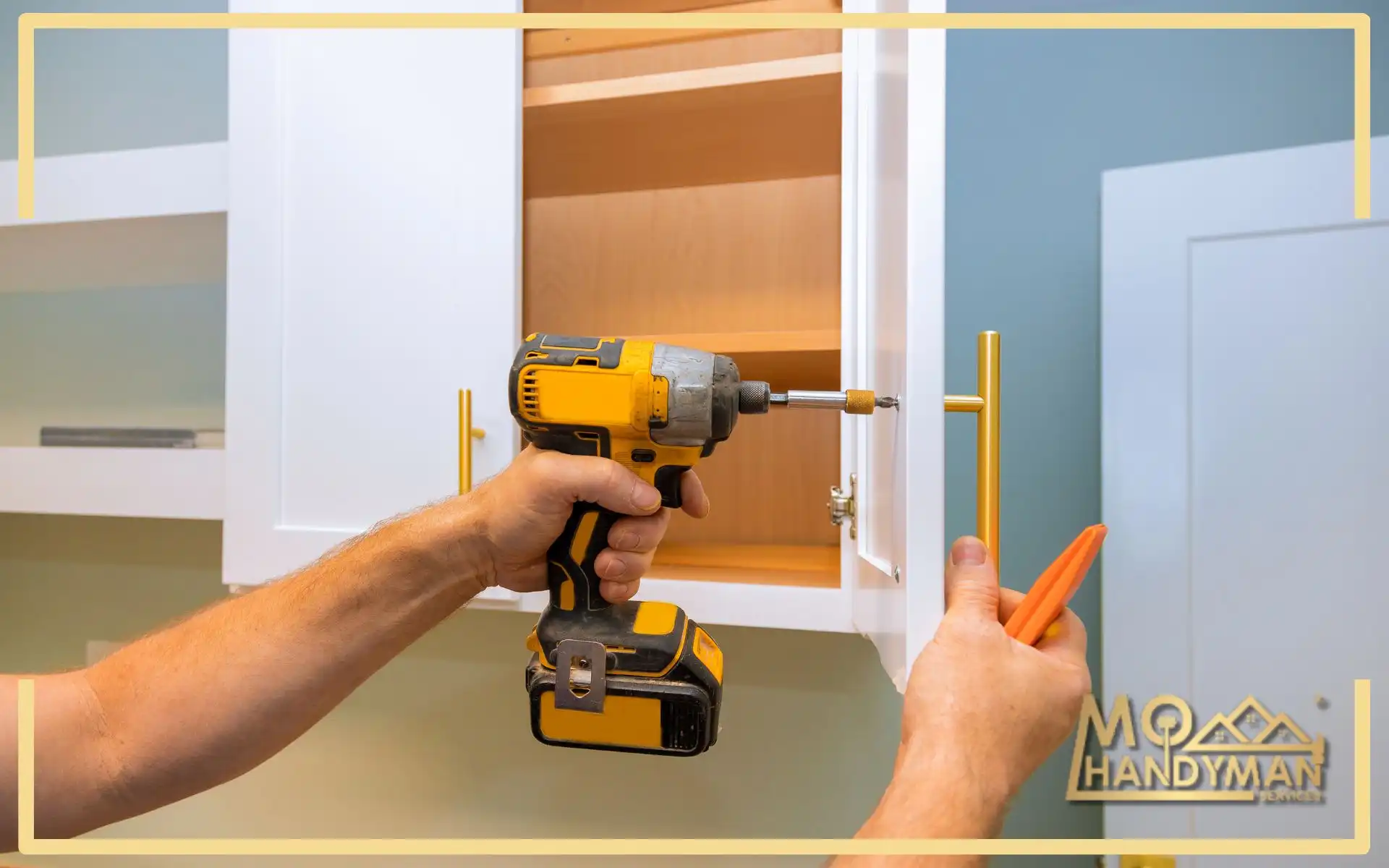 A close-up view of a kitchen renovation in progress, with a contractor's hands expertly fitting new, stylish gold handles to white cabinetry, using a power drill for precision, signifying a modern update in a home's culinary space.