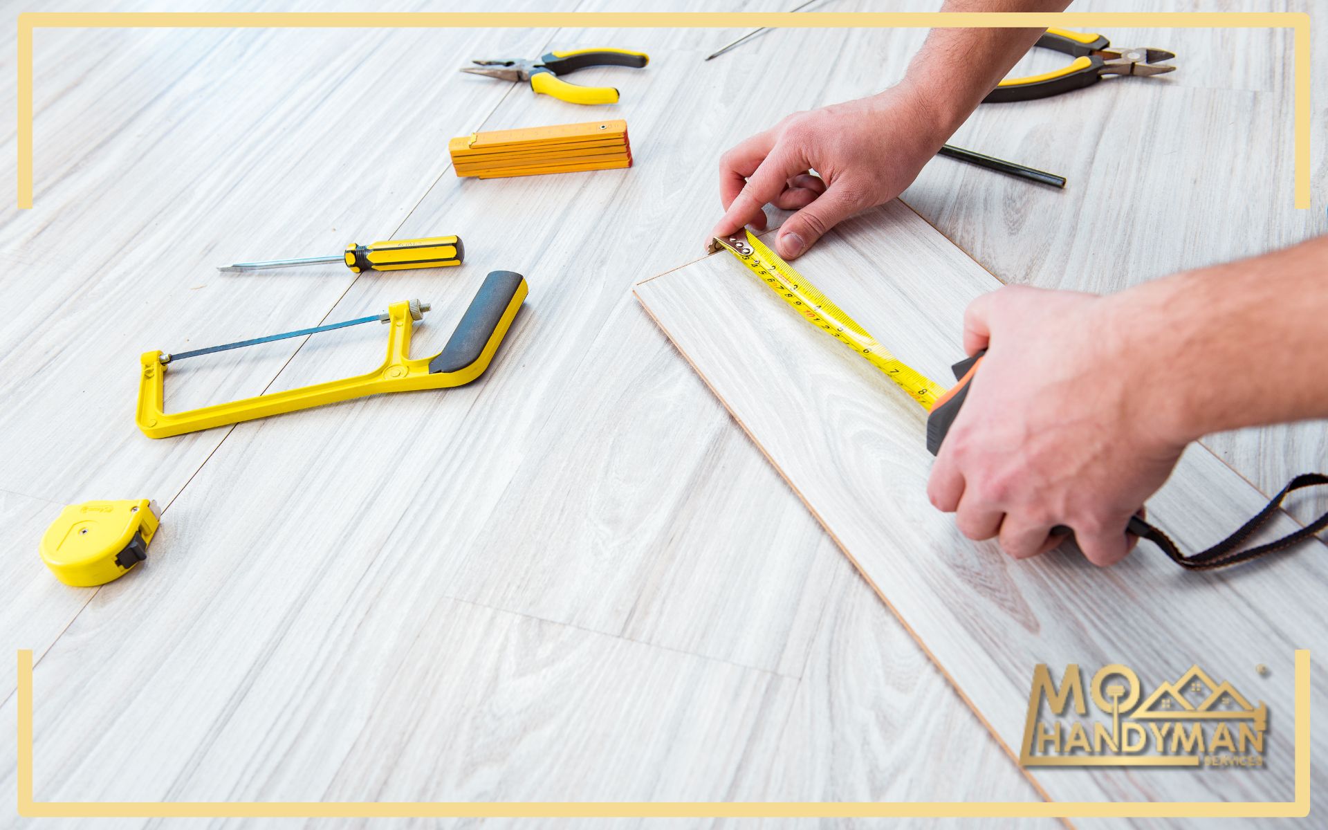 Hands of a professional handyman measure laminate flooring with a tape measure, surrounded by essential tools like a saw, pencil, and cutter for precise installation. The MoHandyman logo on the image signifies expert flooring services.