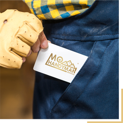 Mo Handyman Services Business card coming out of a pocket