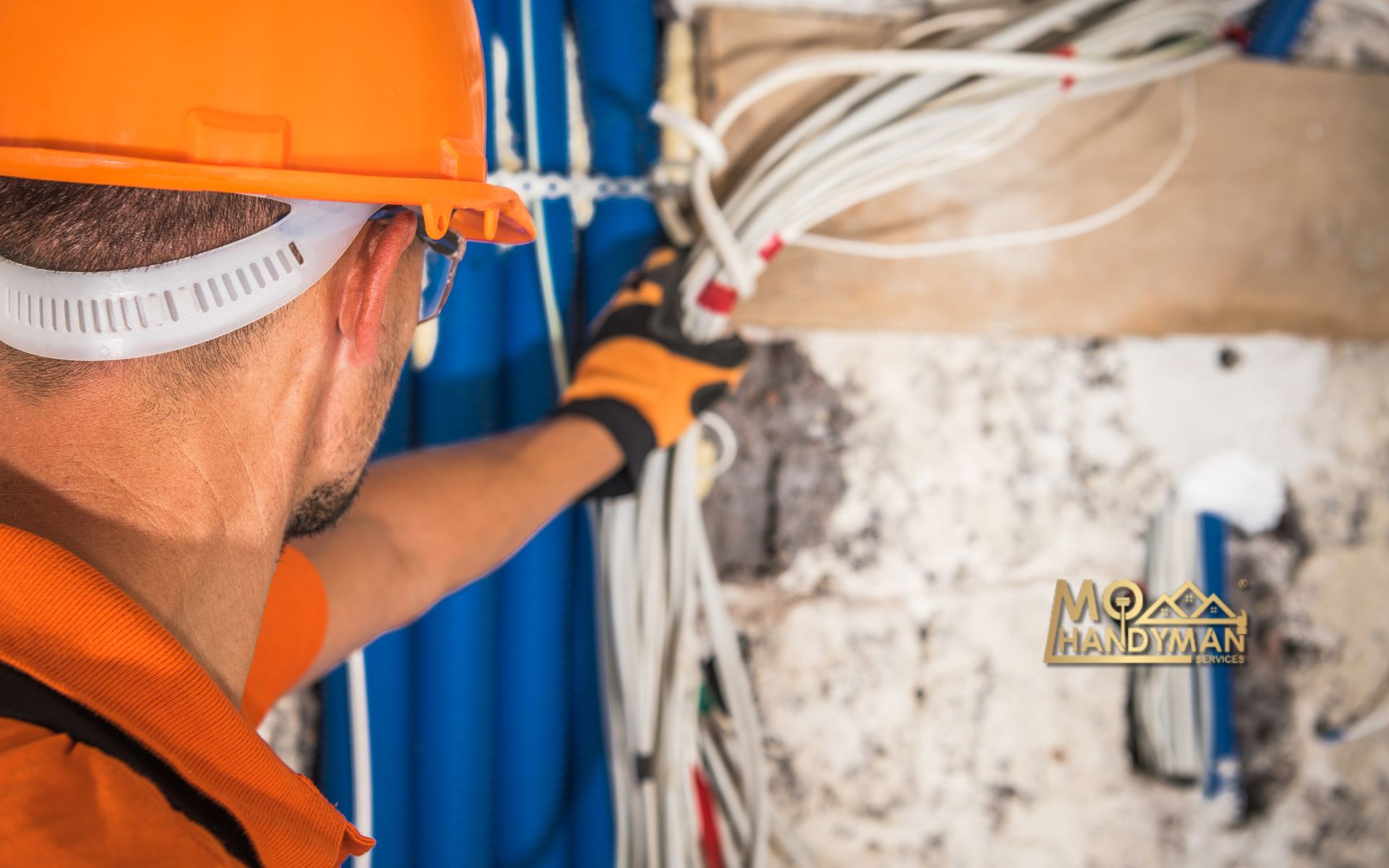 Expert electrical contractor reviewing blueprints for a home safety project, showcasing skills in choosing the right professional for electrical upgrades and repairs.