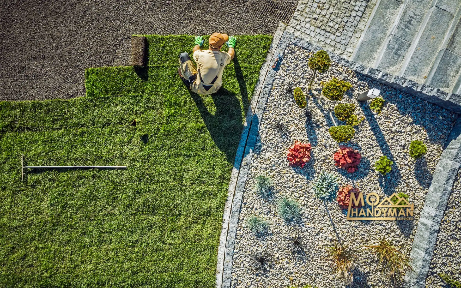 Aerial view of a landscaper enhancing a lush garden with eco-friendly landscaping techniques, showcasing vibrant plants and sleek hardscaping solutions next to a MO Handyman Services sign.