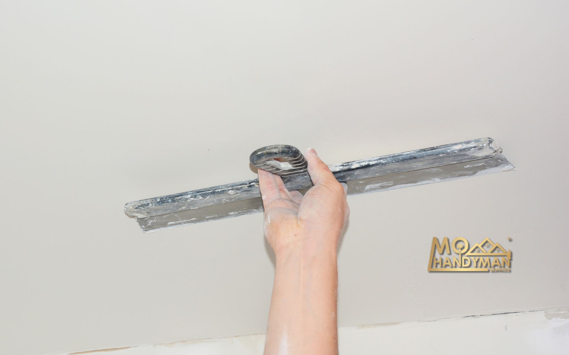 Step-by-step tutorial on plaster ceiling repair showcasing essential techniques and tools for achieving a smooth finish, perfect for DIY enthusiasts looking to enhance their home interiors.