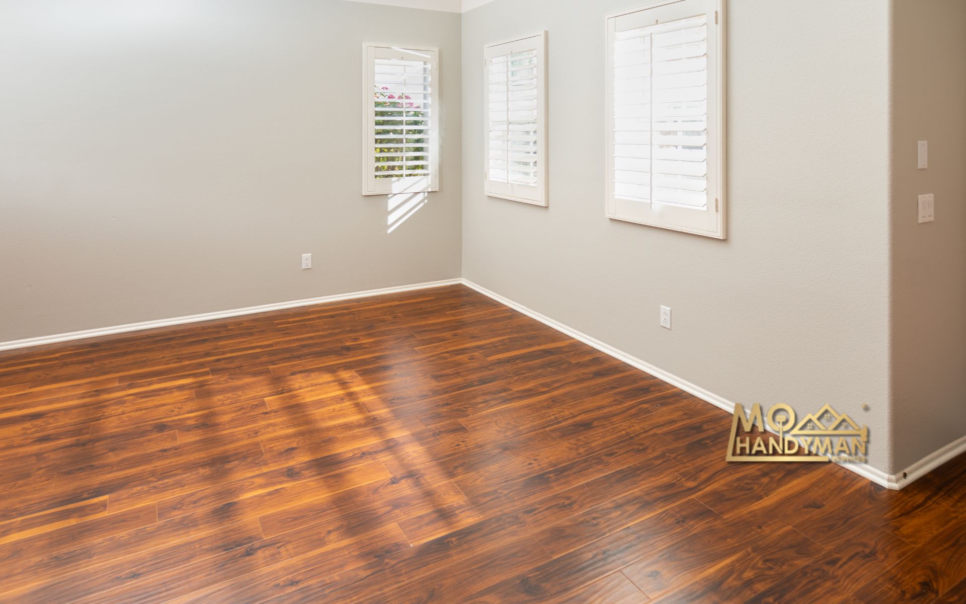 Vinyl flooring transformation in a modern living room, showcasing the sleek and affordable upgrade from outdated to chic, embodying the innovative flooring installation tips for a stunning look.